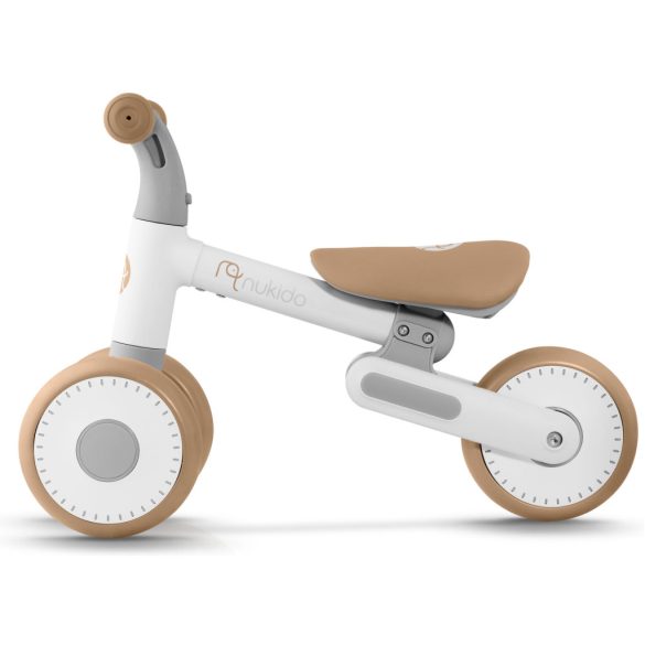 Háromkerekű futóbicikli, Nukido NK-603, bézs, EVA habkerekek 15 cm, állítható ülésmagasság 25–28 cm, kormányfordulás határoló, 12 hónapos kortól