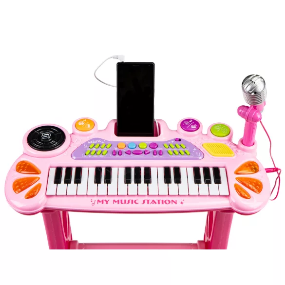 Gyerek szintetizátor, Multistore HC490441 , rózsaszín, 45 x 21 x 60 cm, 31 billentyűs, mikrofonnal, telefon/MP3 csatlakozás, előre programozott dallamok, elemes (3 x AA, nem tartozék), 3 éves kortól ajánlott